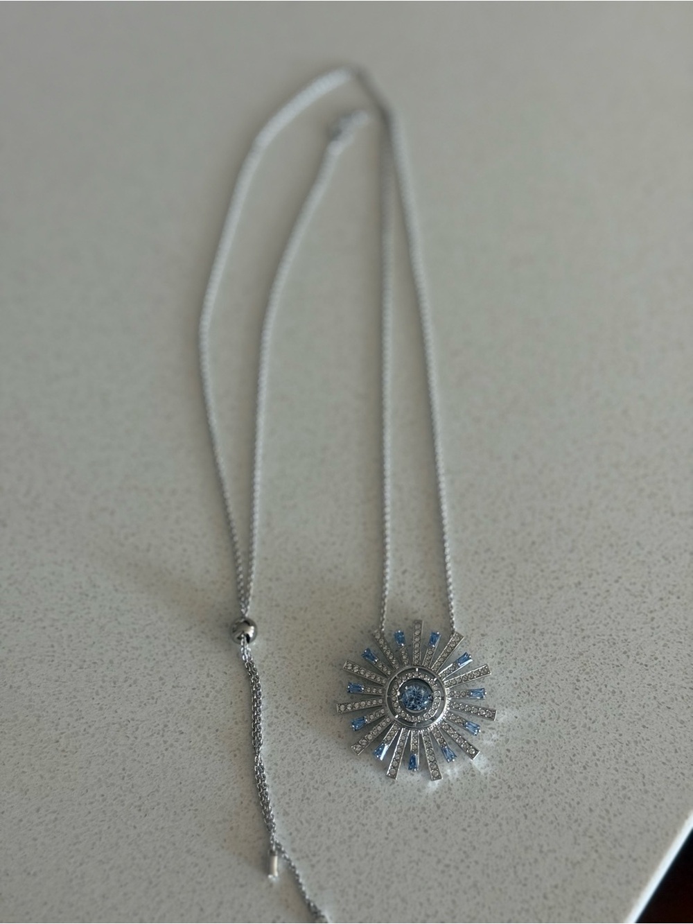 Swarovski Silver Sunburst Necklace with Blue Crystals